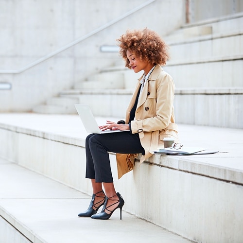 A female professional working on her laptop