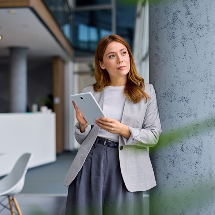 A female professional standing at the office