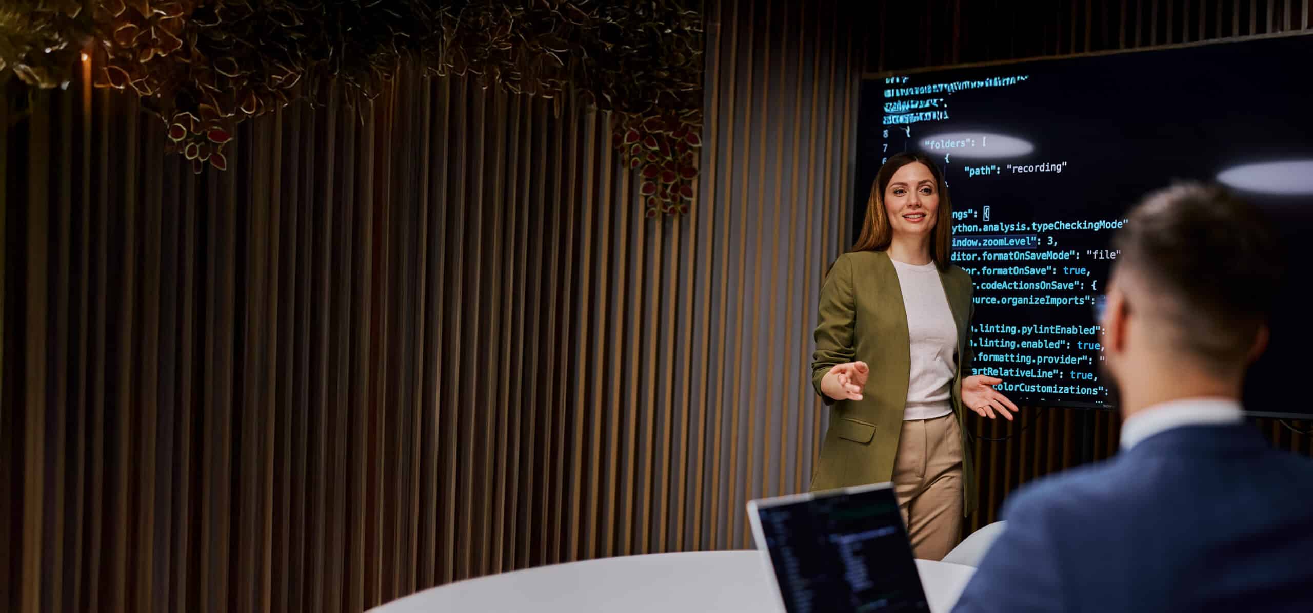 A female presenting computer code.