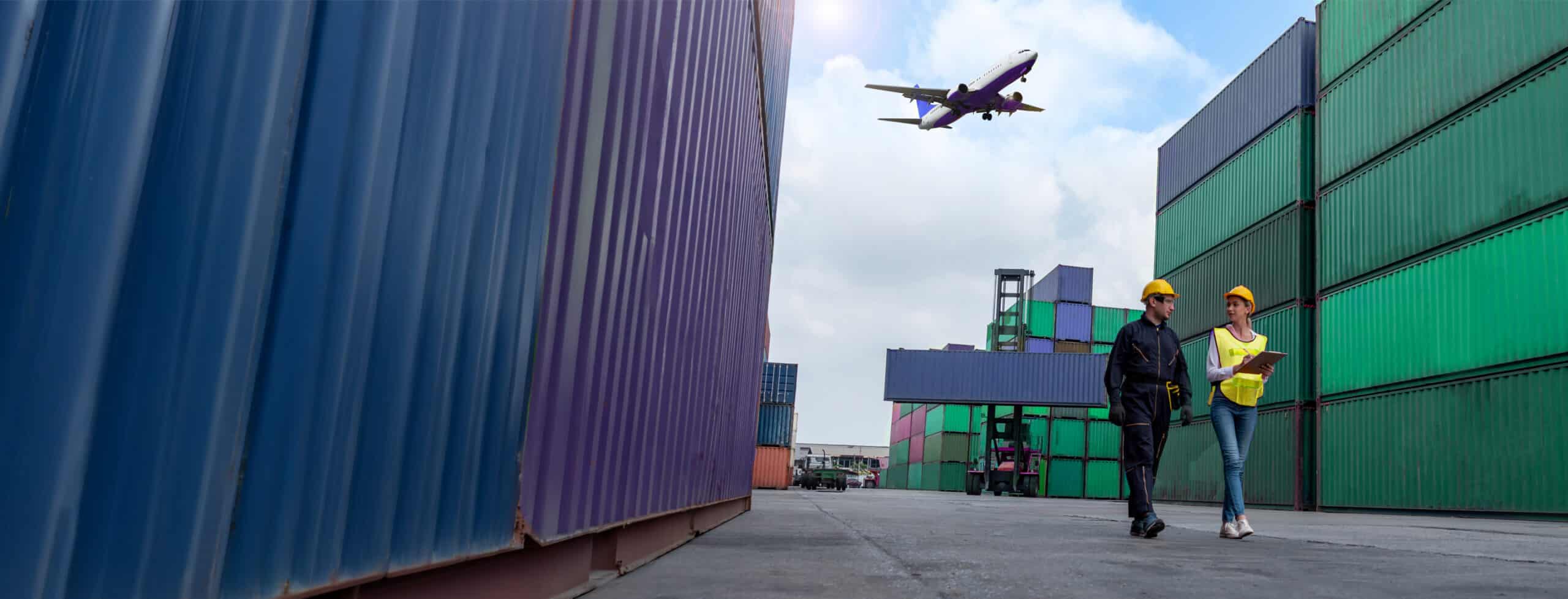 Container yard workers, plane overhead.