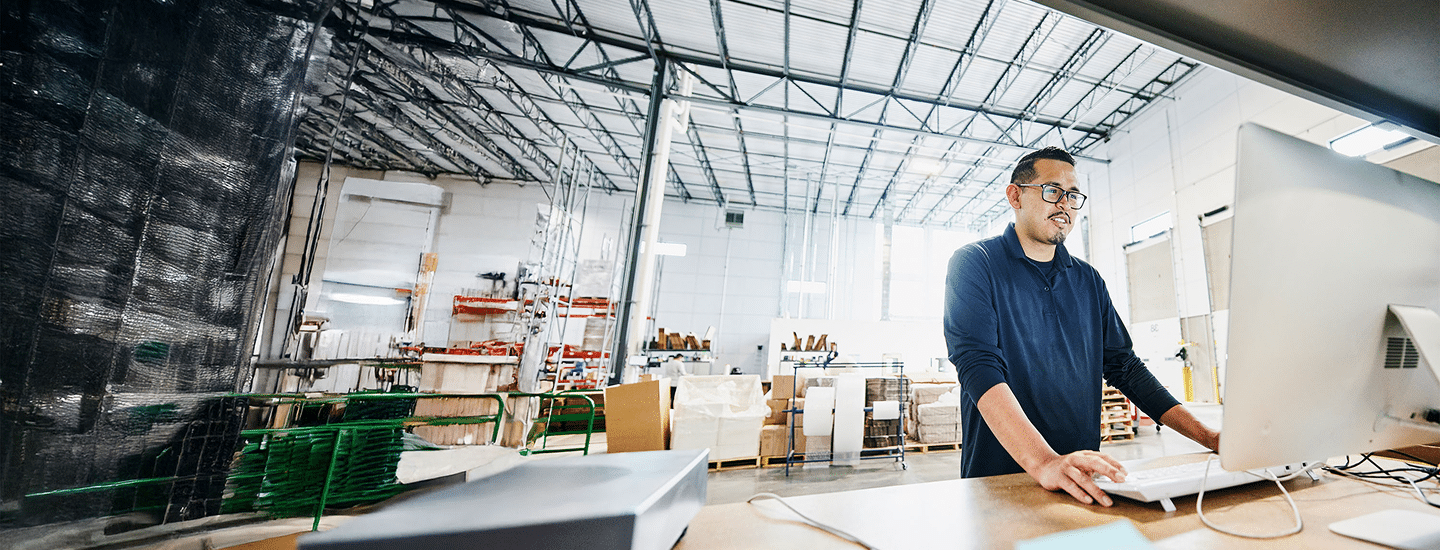 Warehouse employee using computer