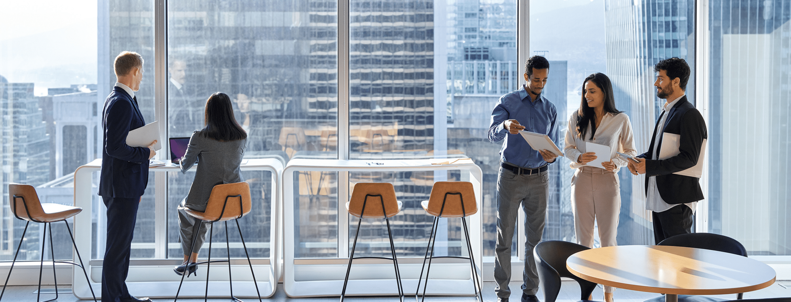 Three professionals reviewing documents together