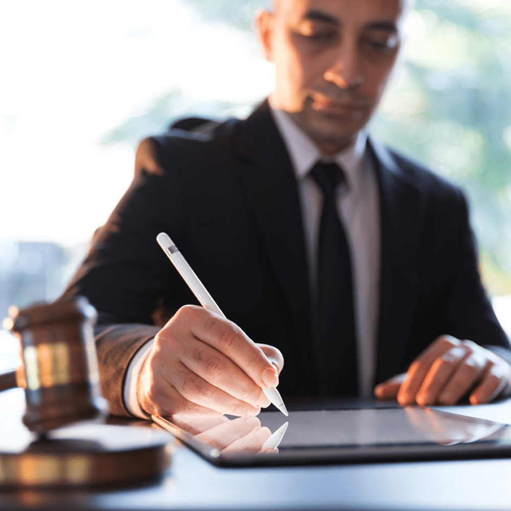 Professional writing on a tablet with a stylus.