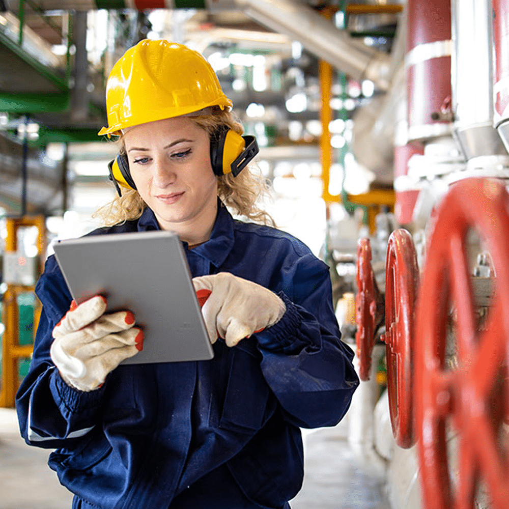 Female industrial worker with tablet.